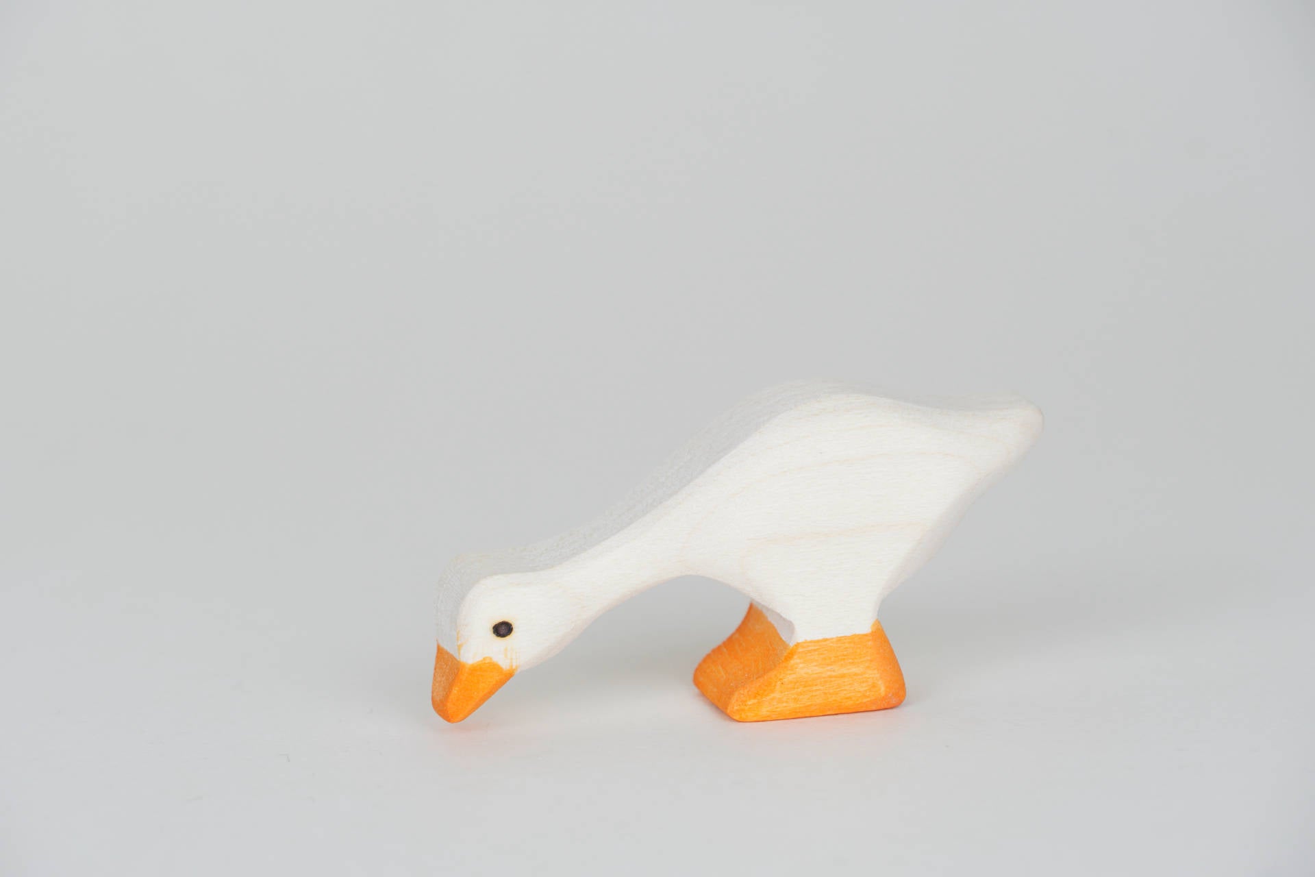 Gans klein weiß Kopf unten